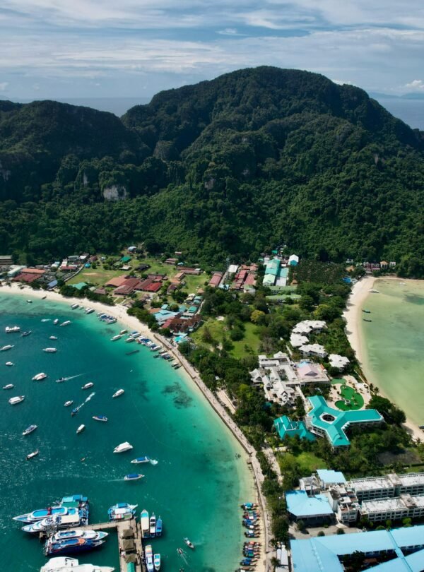 A breathtaking aerial shot of a tropical island with lush greenery and turquoise waters, perfect for travel lovers.